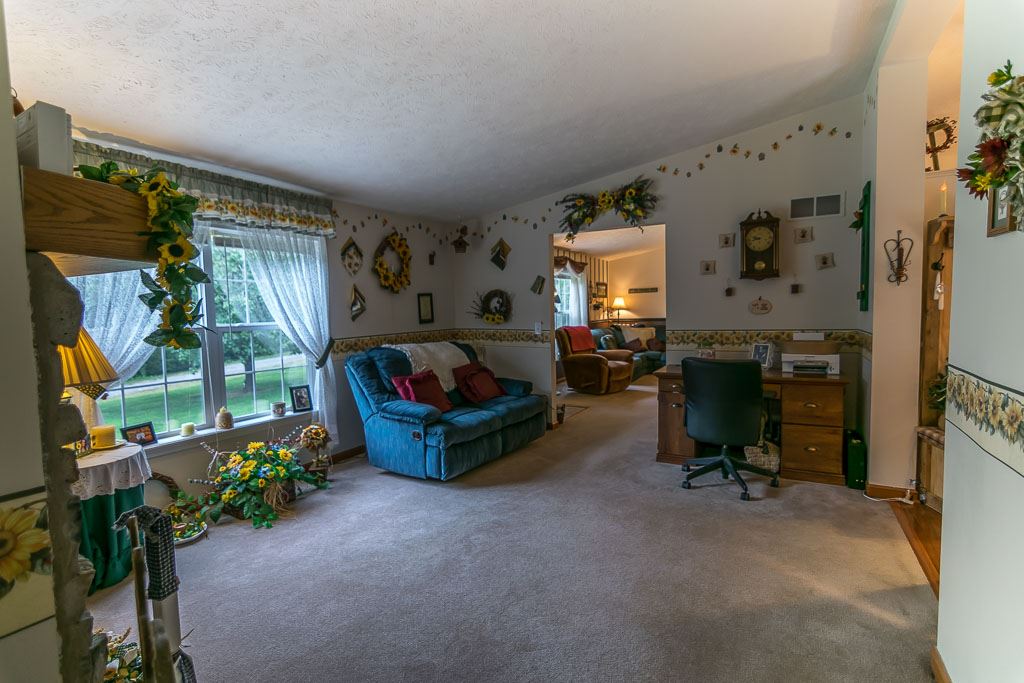 325 Steeles Fort Road Raphine, VA 24472 - Photo 24 of 50 a living room with furniture and a flat screen tv