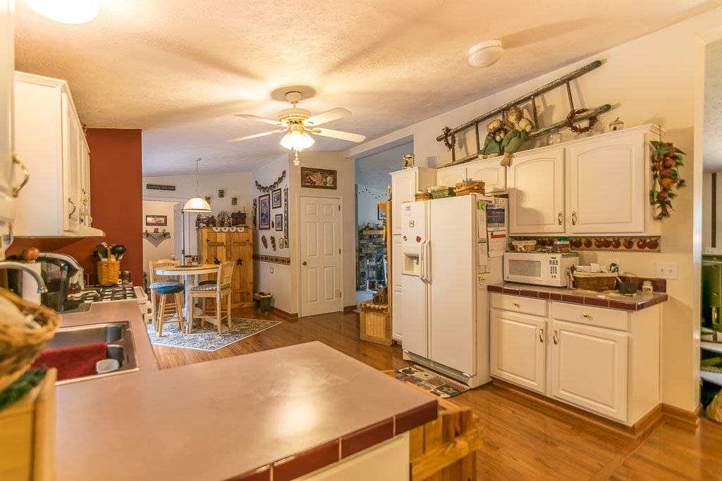 325 Steeles Fort Road Raphine, VA 24472 - Photo 27 of 50 a kitchen with stainless steel appliances a stove a refrigerator and cabinets