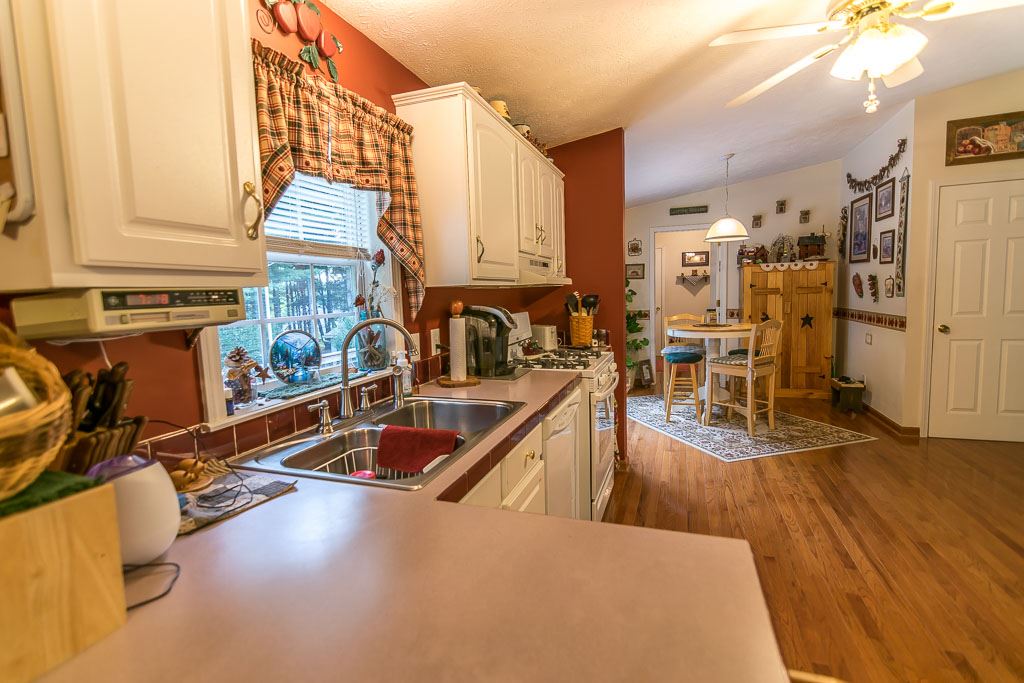 325 Steeles Fort Road Raphine, VA 24472 - Photo 28 of 50 a view of a kitchen with kitchen island granite countertop a large window and a counter space
