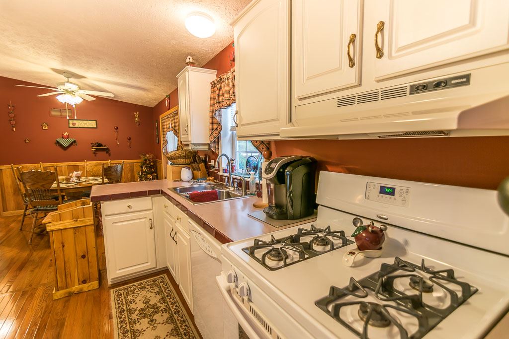 325 Steeles Fort Road Raphine, VA 24472 - Photo 29 of 50 a kitchen with a stove a sink and a microwave