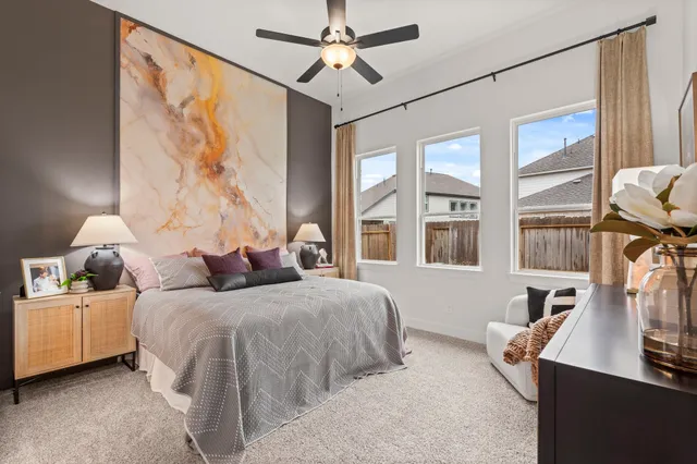 a bedroom with double bed and a window