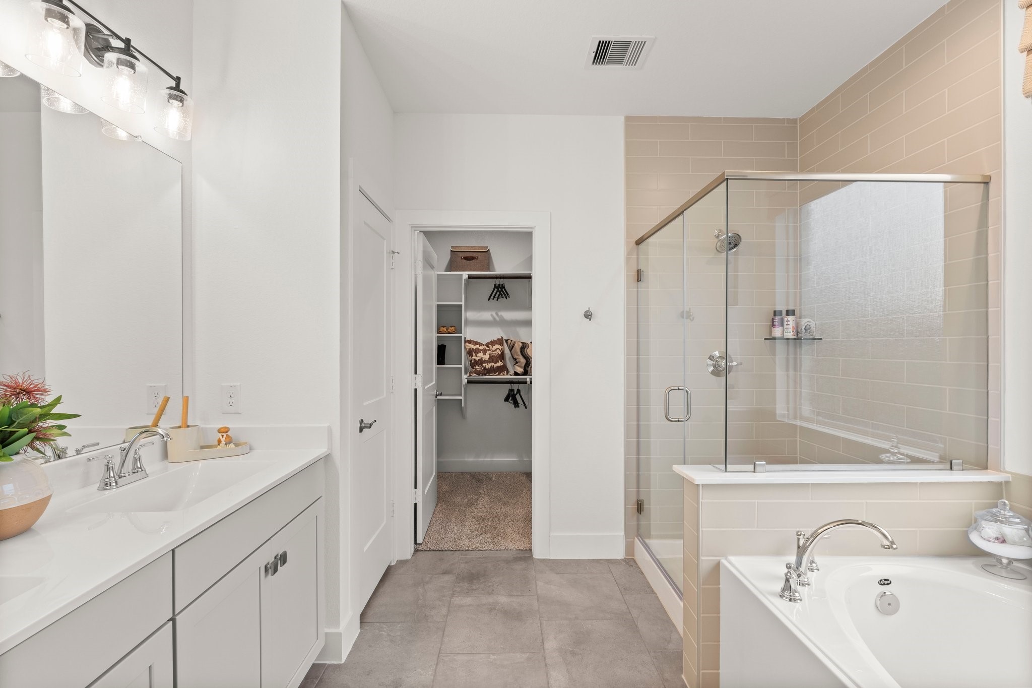 30951 Breezy Way Fulshear, TX 77423 - Photo 14 of 41 a bathroom with a sink a toilet and shower
