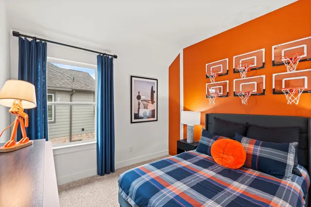 a bedroom with a bed and dresser