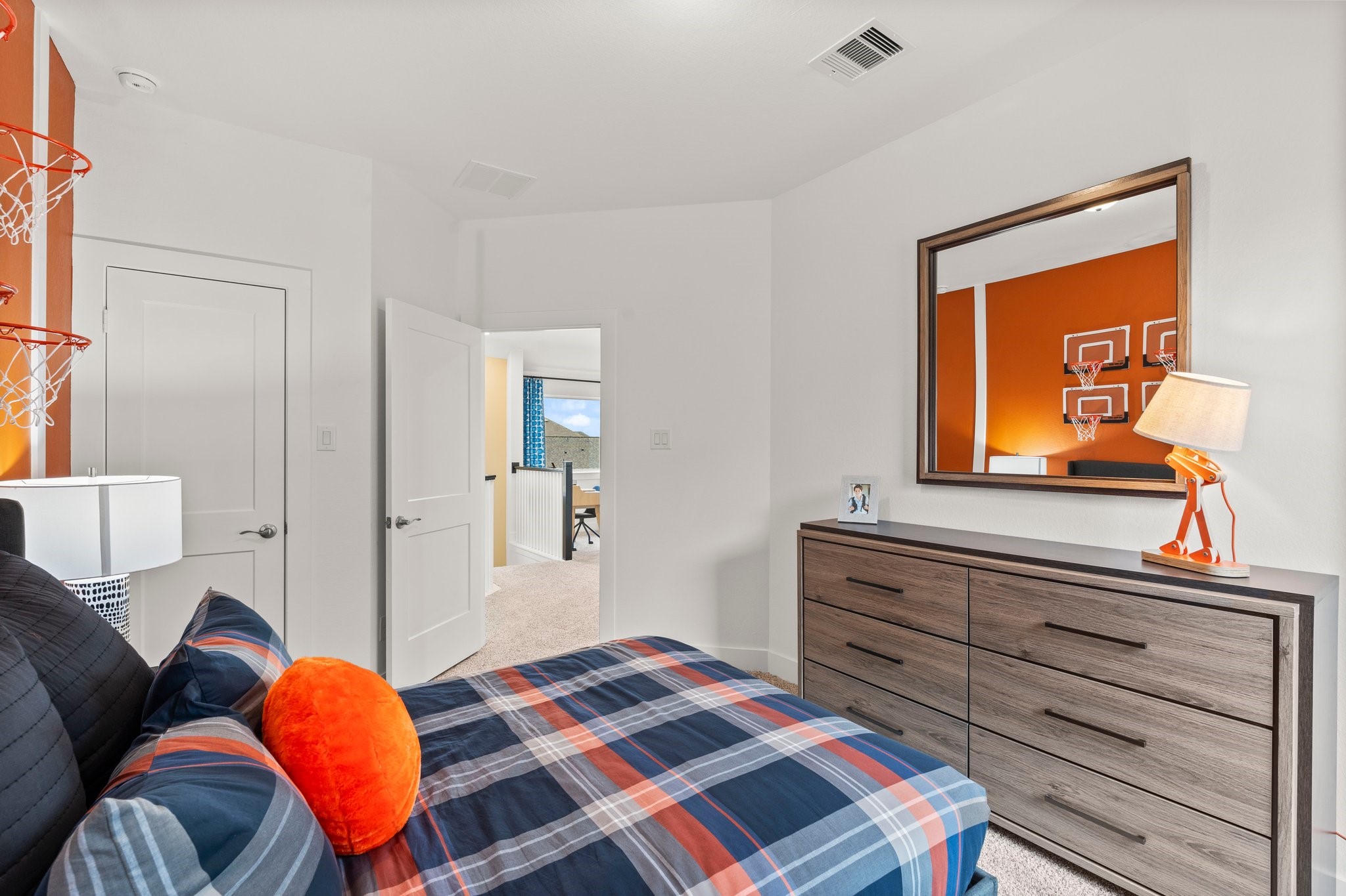 30951 Breezy Way Fulshear, TX 77423 - Photo 18 of 41 a bedroom with a bed and wooden floor