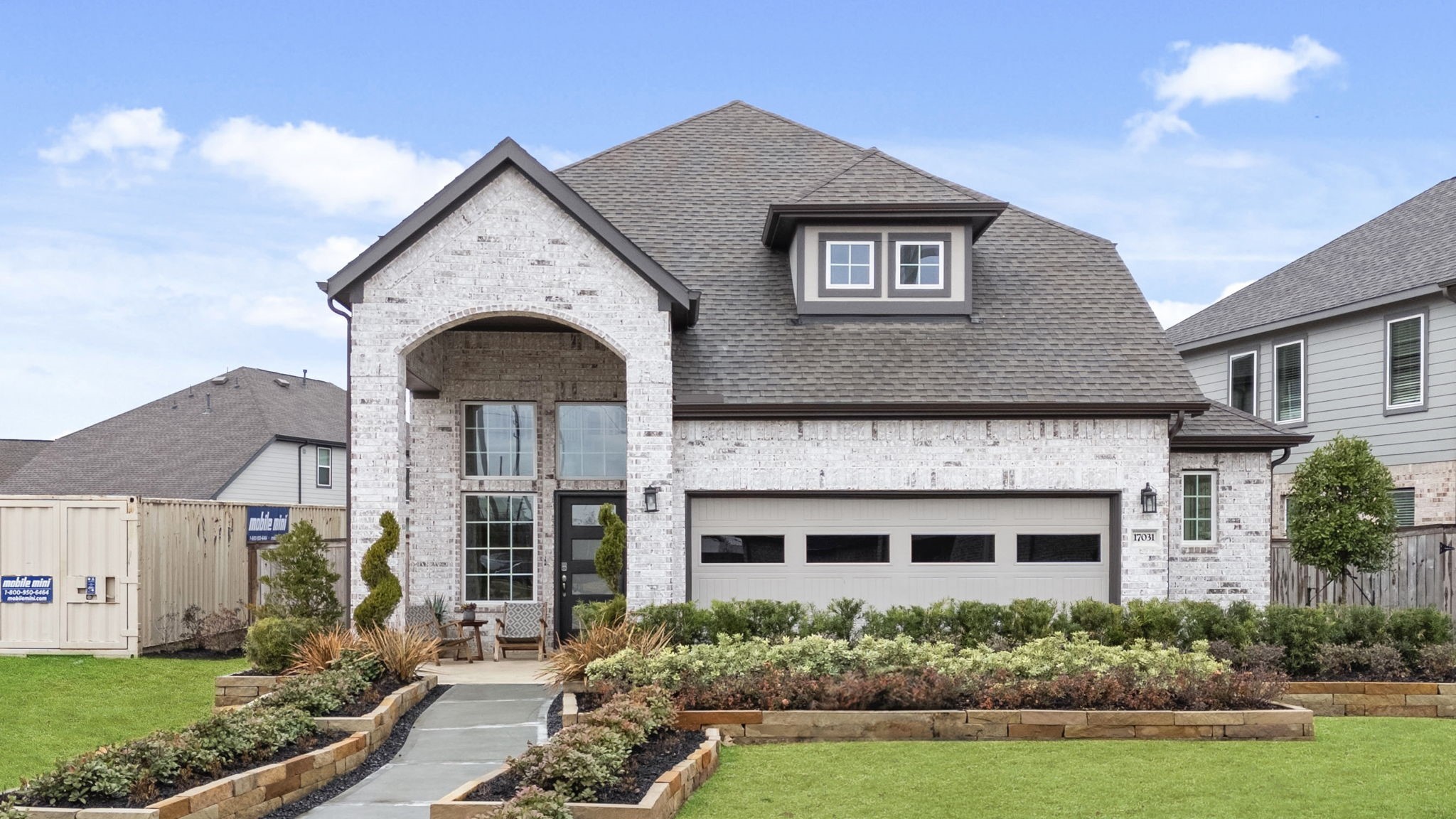 30951 Breezy Way Fulshear, TX 77423 - Photo 2 of 41 a front view of a house with a yard