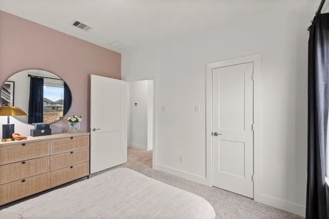a bedroom with a bed and a closet