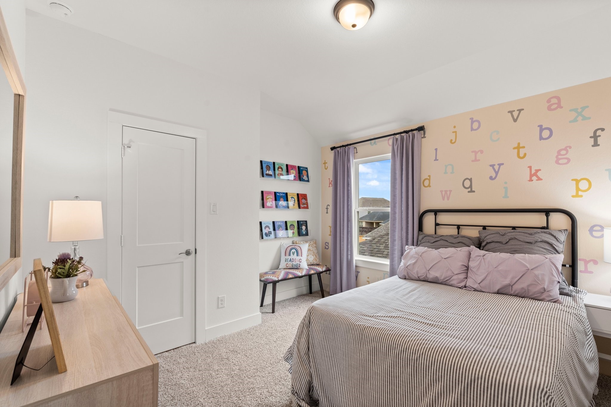 30951 Breezy Way Fulshear, TX 77423 - Photo 24 of 41 a bedroom with a bed and a flat tv screen on the dresser