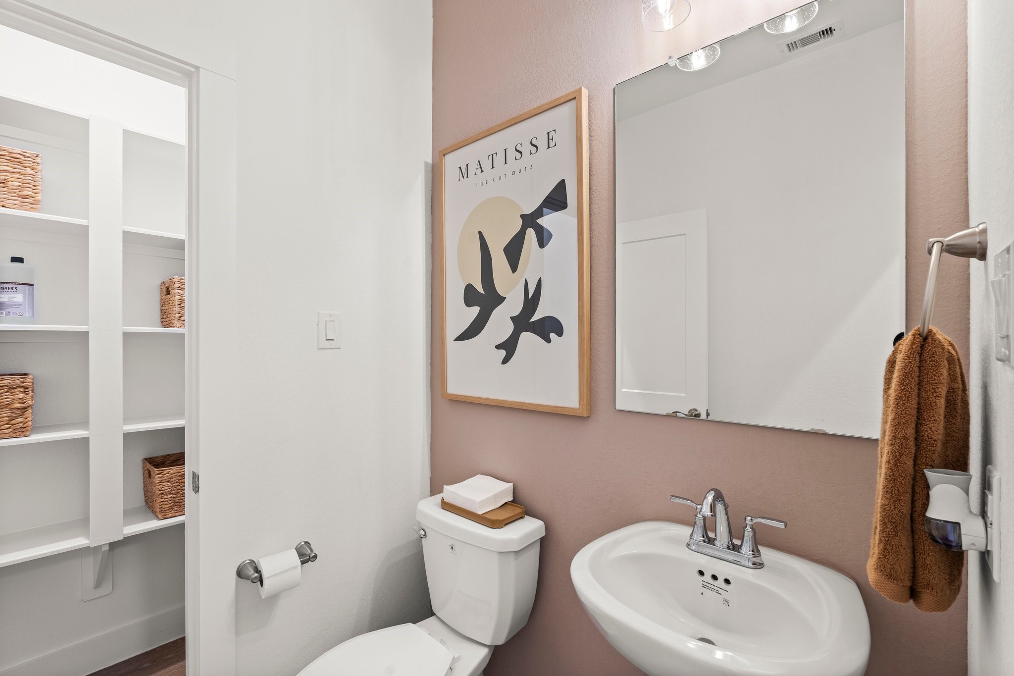 30951 Breezy Way Fulshear, TX 77423 - Photo 6 of 41 a bathroom with a toilet sink and mirror