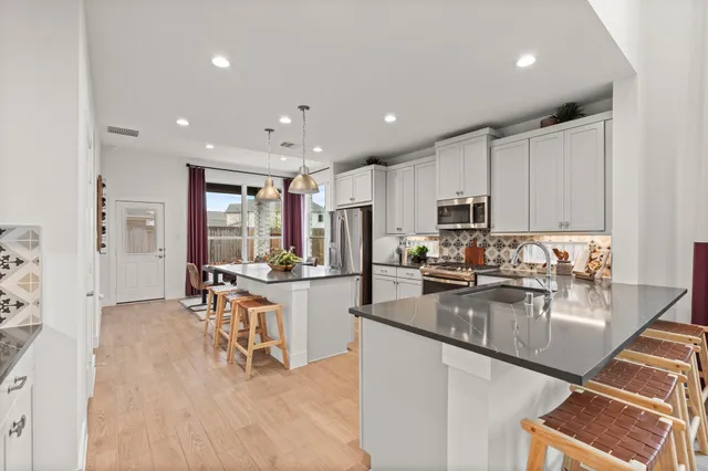 a large kitchen with cabinets