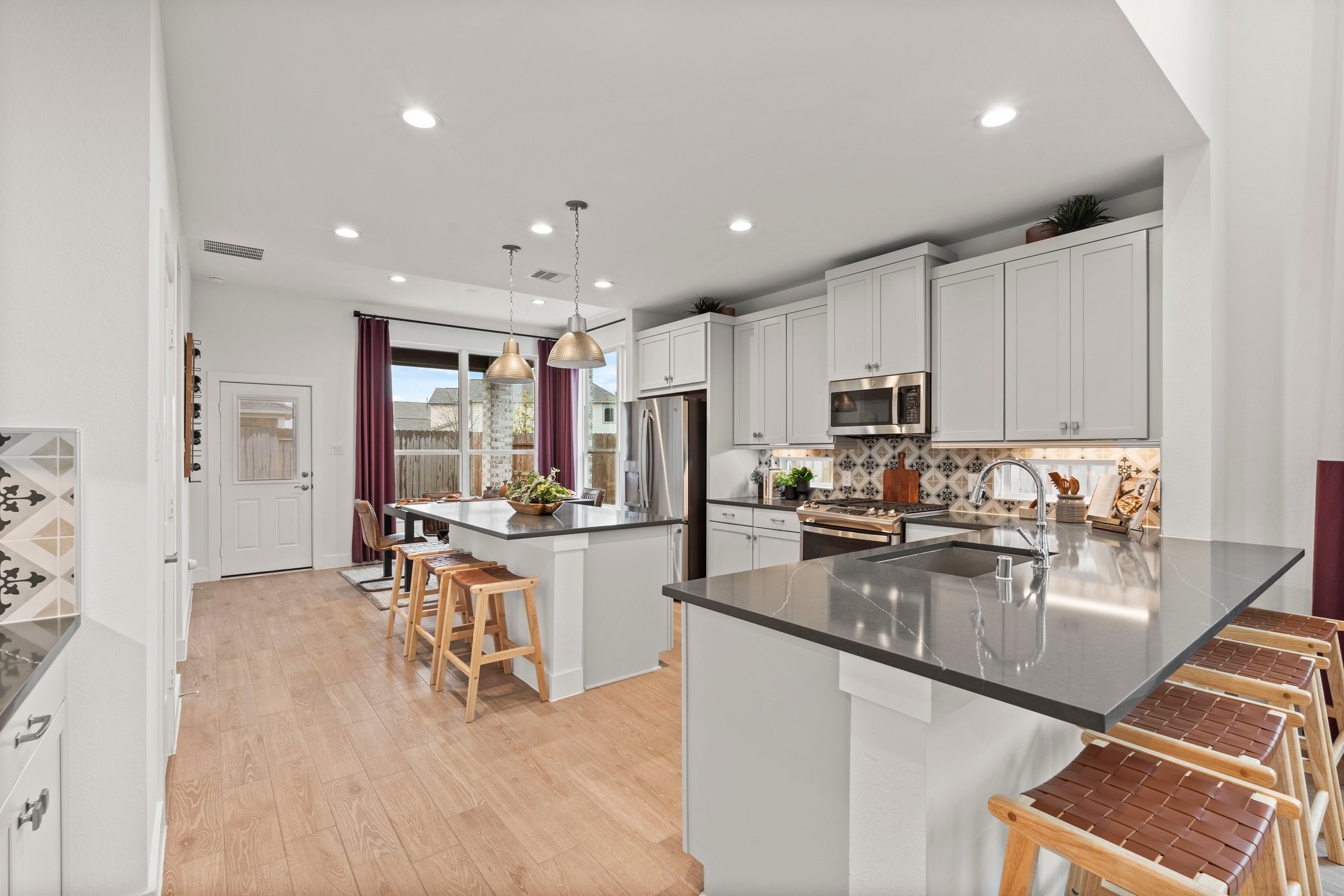 30951 Breezy Way Fulshear, TX 77423 - Photo 8 of 41 a large kitchen with cabinets
