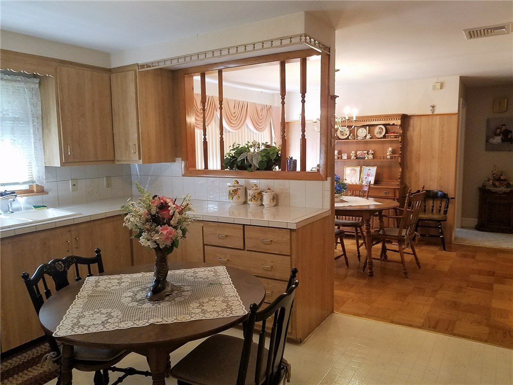 76 Park Forest Road Cranston, RI 02920 - Photo 4 of 14 Kitchen and dining area.