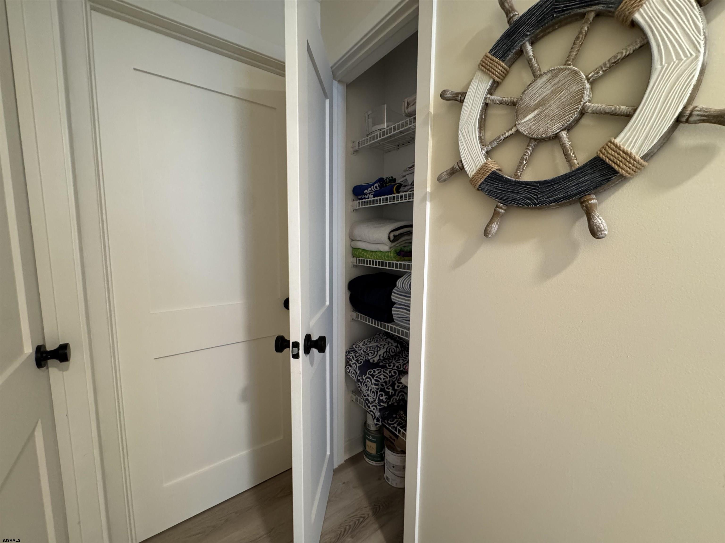 9101 Atlantic Avenue, Unit 202 Margate City, NJ 08402 - Photo 17 of 26 a bathroom with a sink and mirror