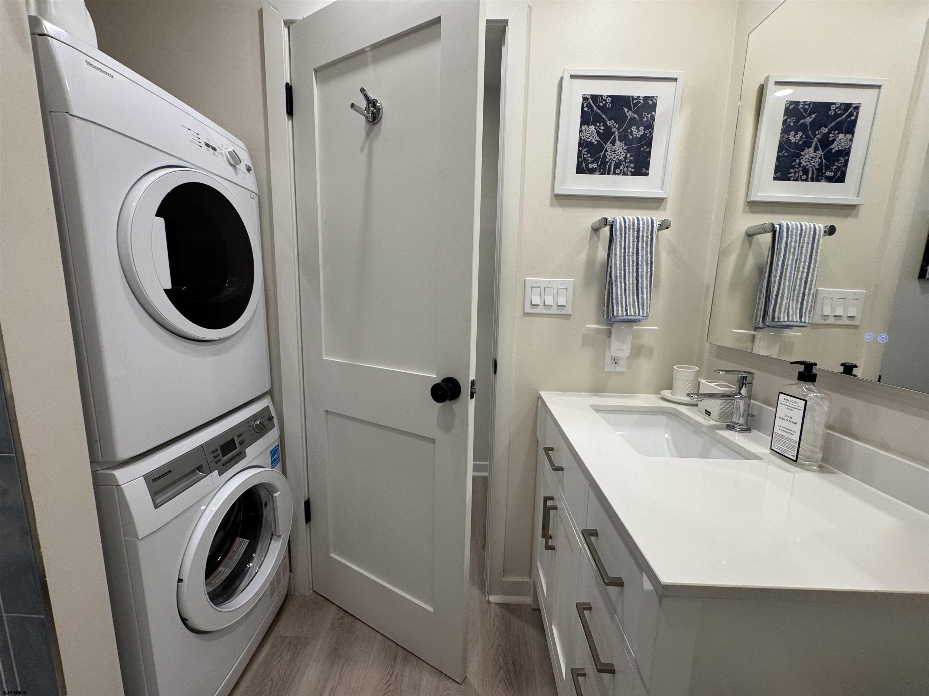9101 Atlantic Avenue, Unit 202 Margate City, NJ 08402 - Photo 18 of 26 a utility room with sink dryer and washer