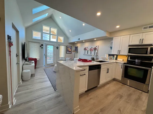 a kitchen with stove and cabinets