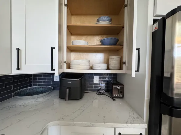a kitchen with a sink a stove and cabinets