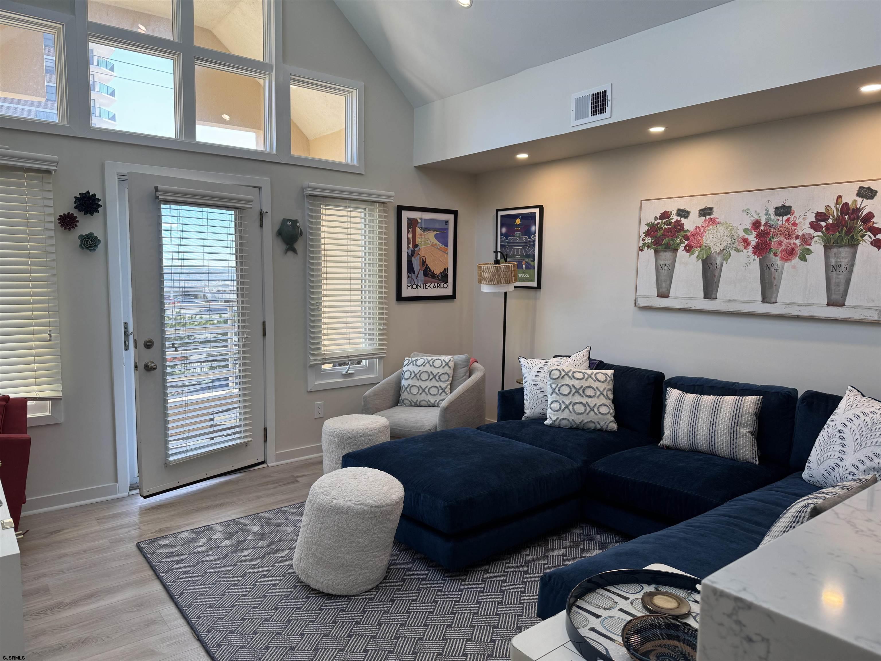 9101 Atlantic Avenue, Unit 202 Margate City, NJ 08402 - Photo 7 of 26 a living room with furniture and a window
