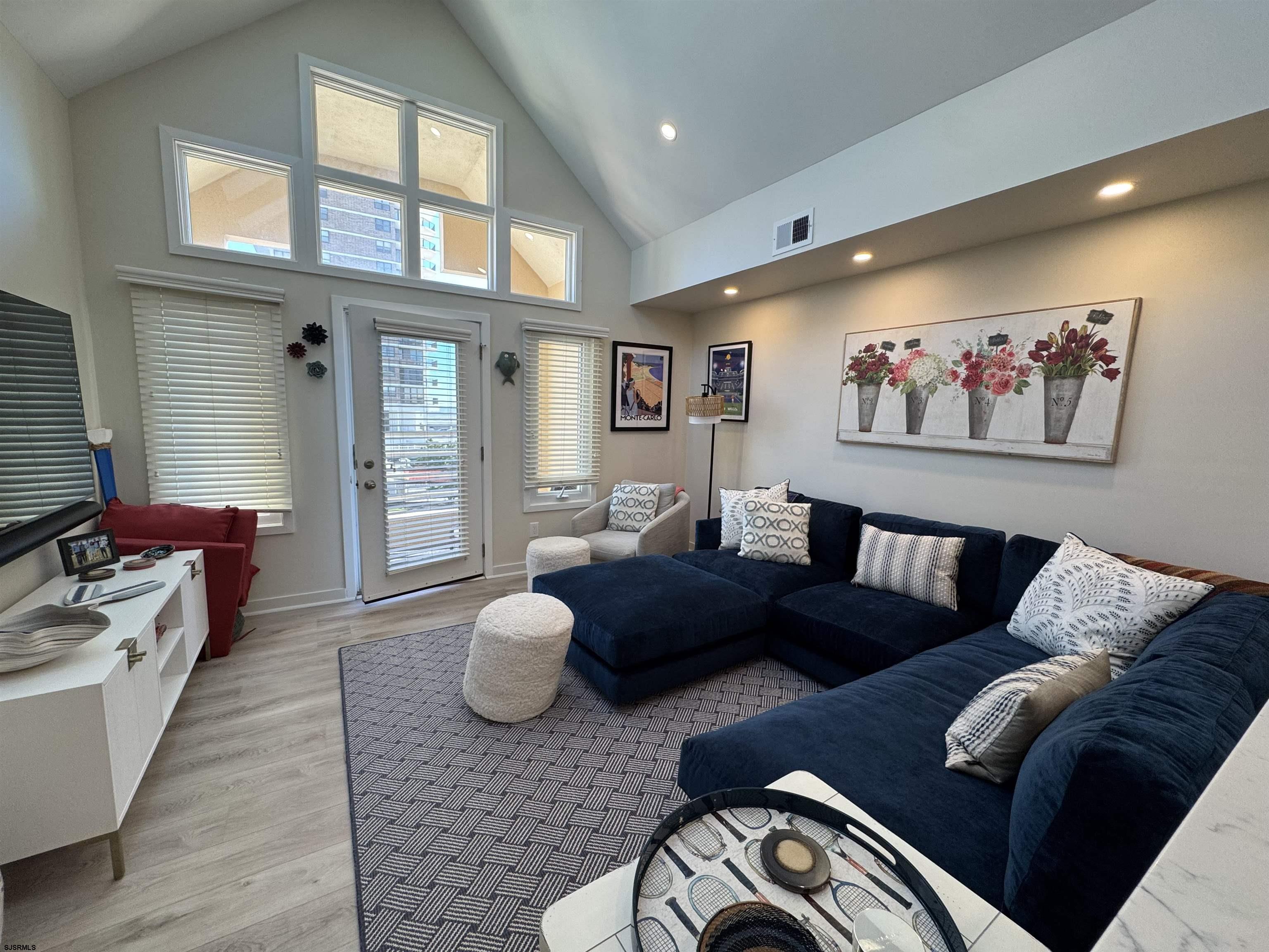 9101 Atlantic Avenue, Unit 202 Margate City, NJ 08402 - Photo 8 of 26 a living room with furniture and a large window