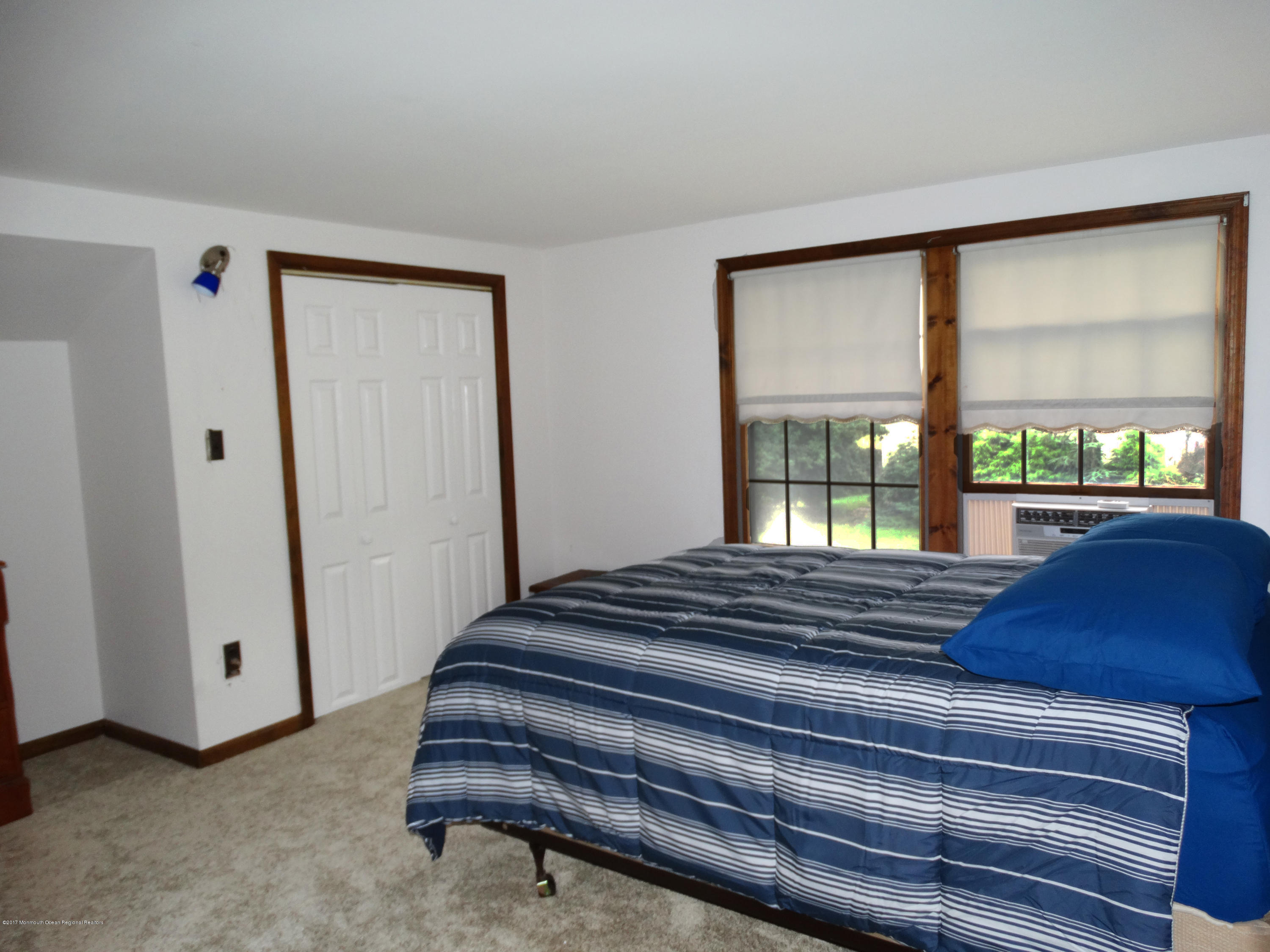 850 Adelphia Road Freehold, NJ 07728 - Photo 12 of 25 a bedroom with a bed and a large window