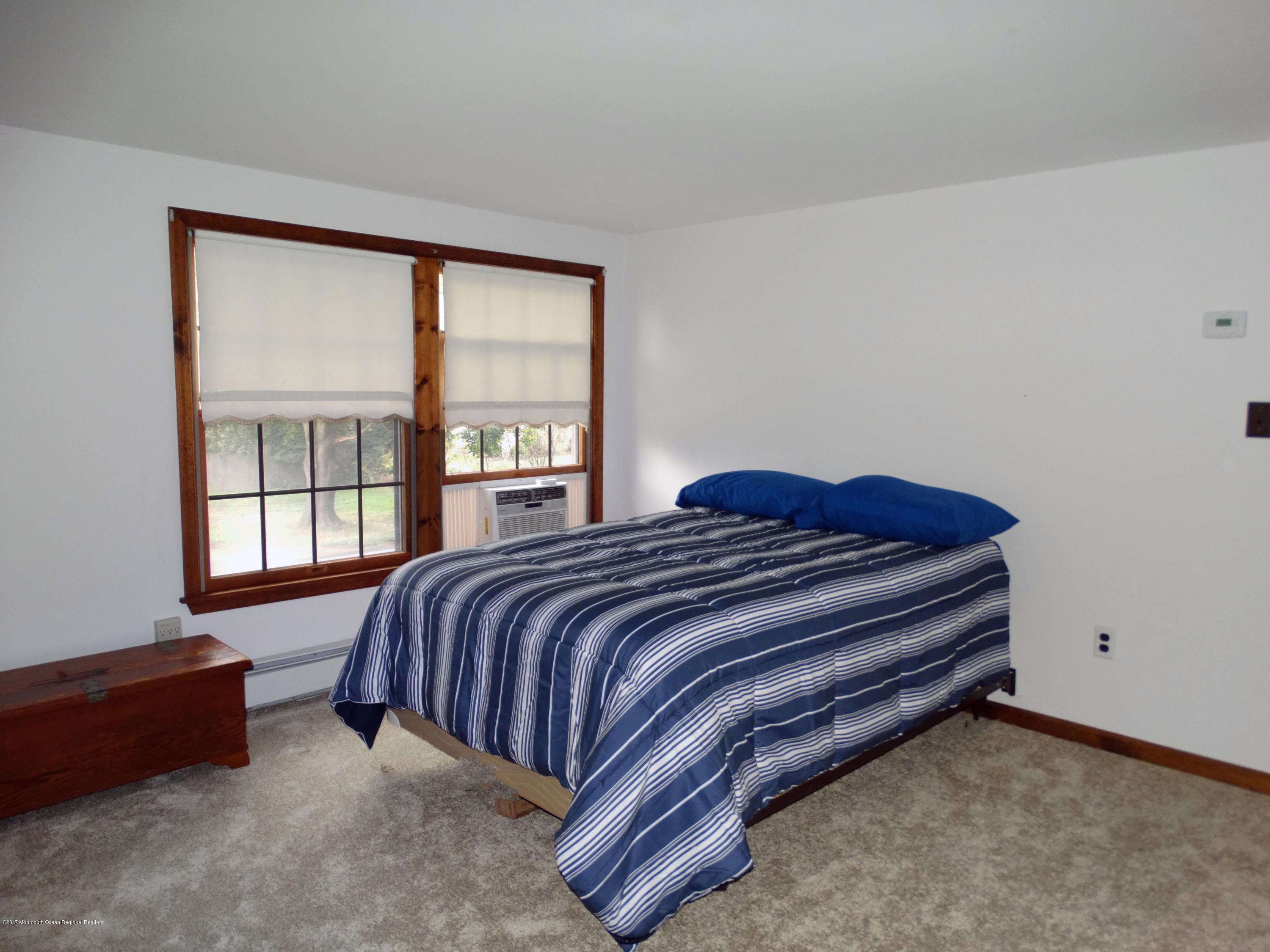 850 Adelphia Road Freehold, NJ 07728 - Photo 13 of 25 a spacious bedroom with a bed and a window
