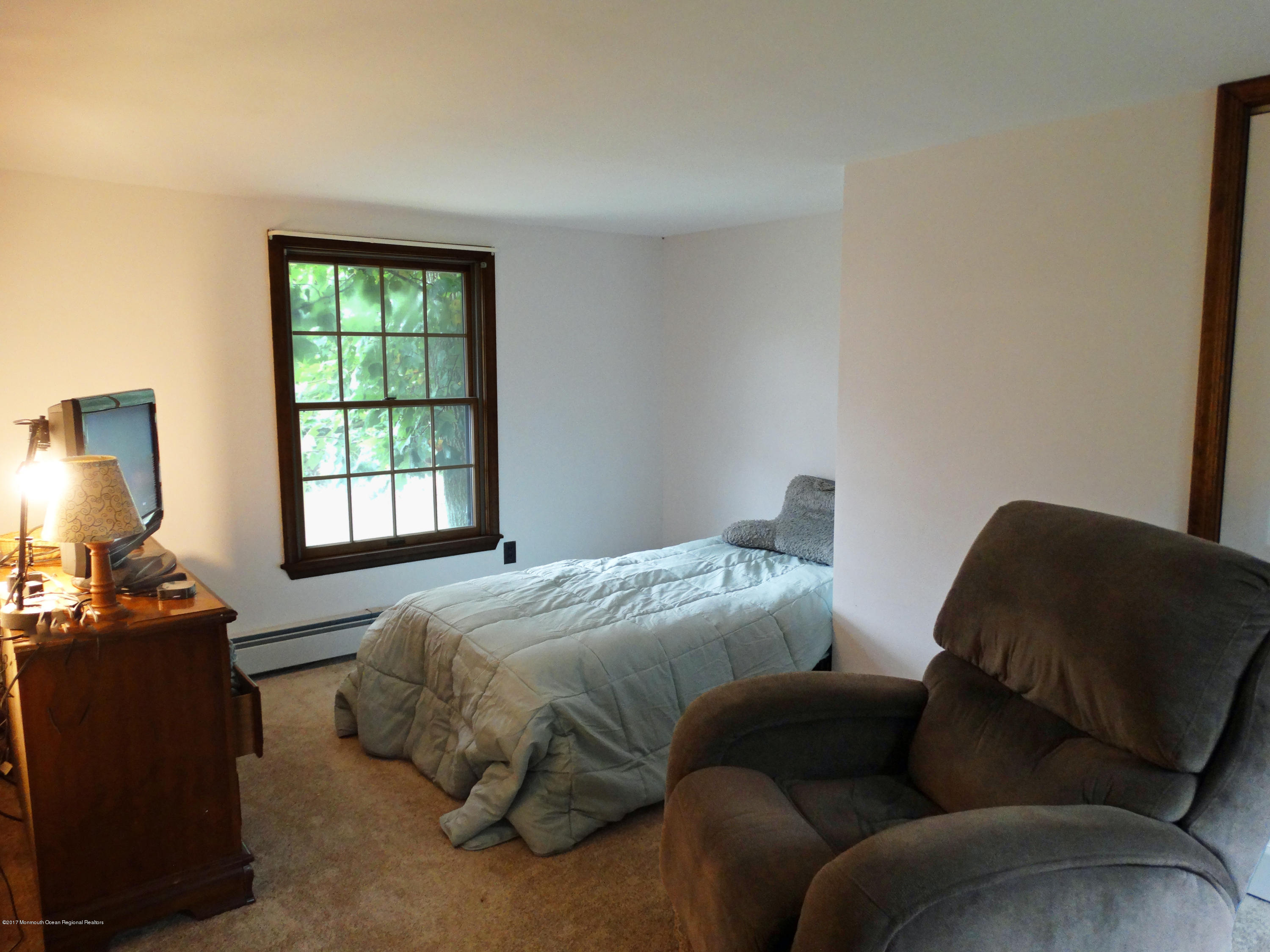 850 Adelphia Road Freehold, NJ 07728 - Photo 14 of 25 a bedroom with a bed and a couch
