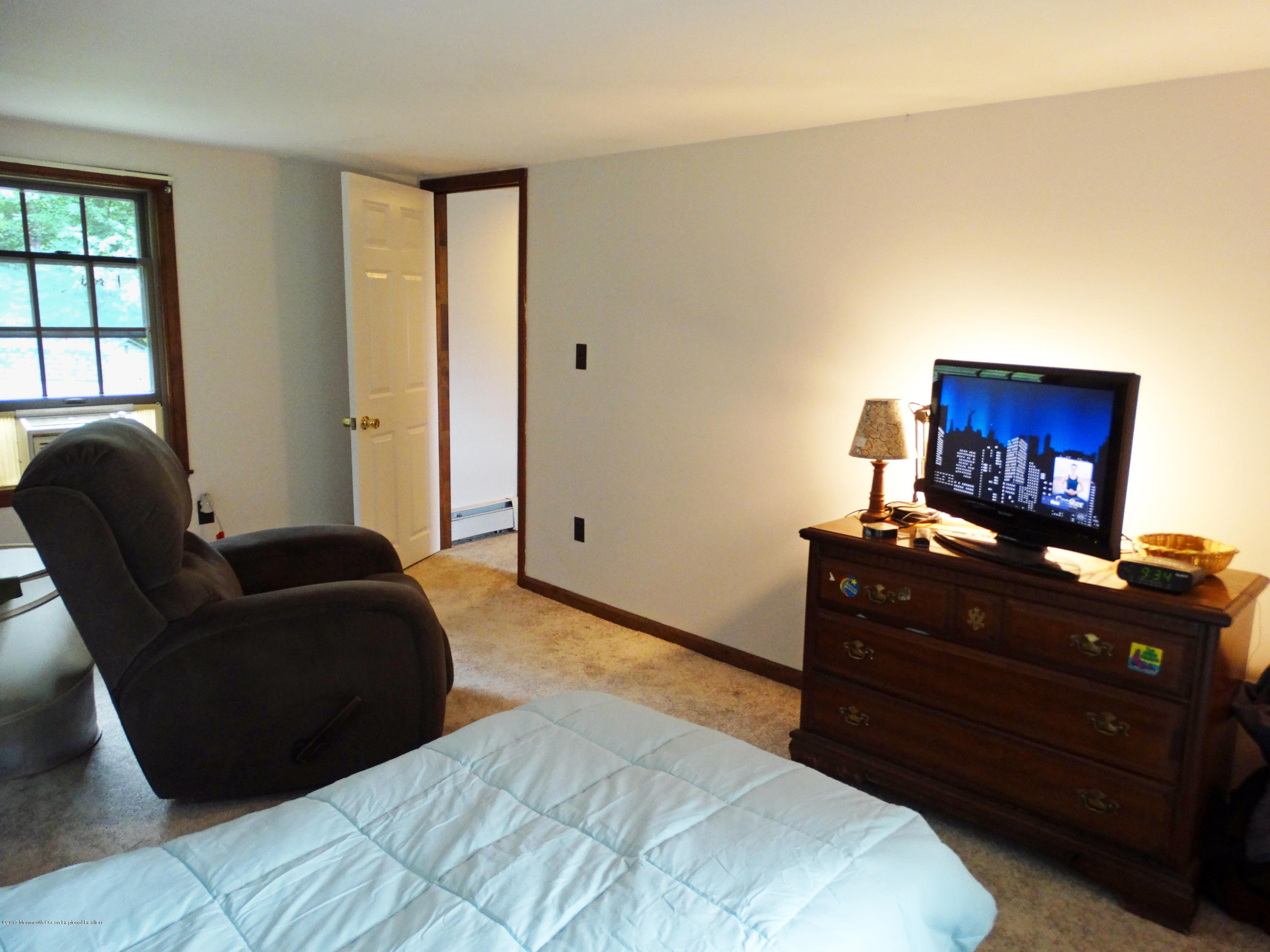 850 Adelphia Road Freehold, NJ 07728 - Photo 16 of 25 a bedroom with a bed and a television