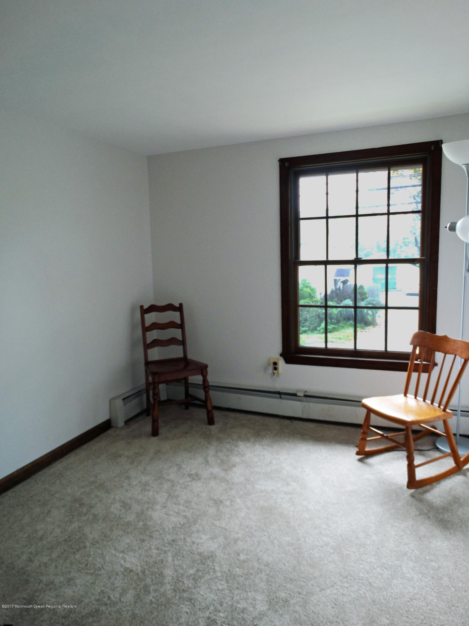 850 Adelphia Road Freehold, NJ 07728 - Photo 17 of 25 a living room with furniture and a window