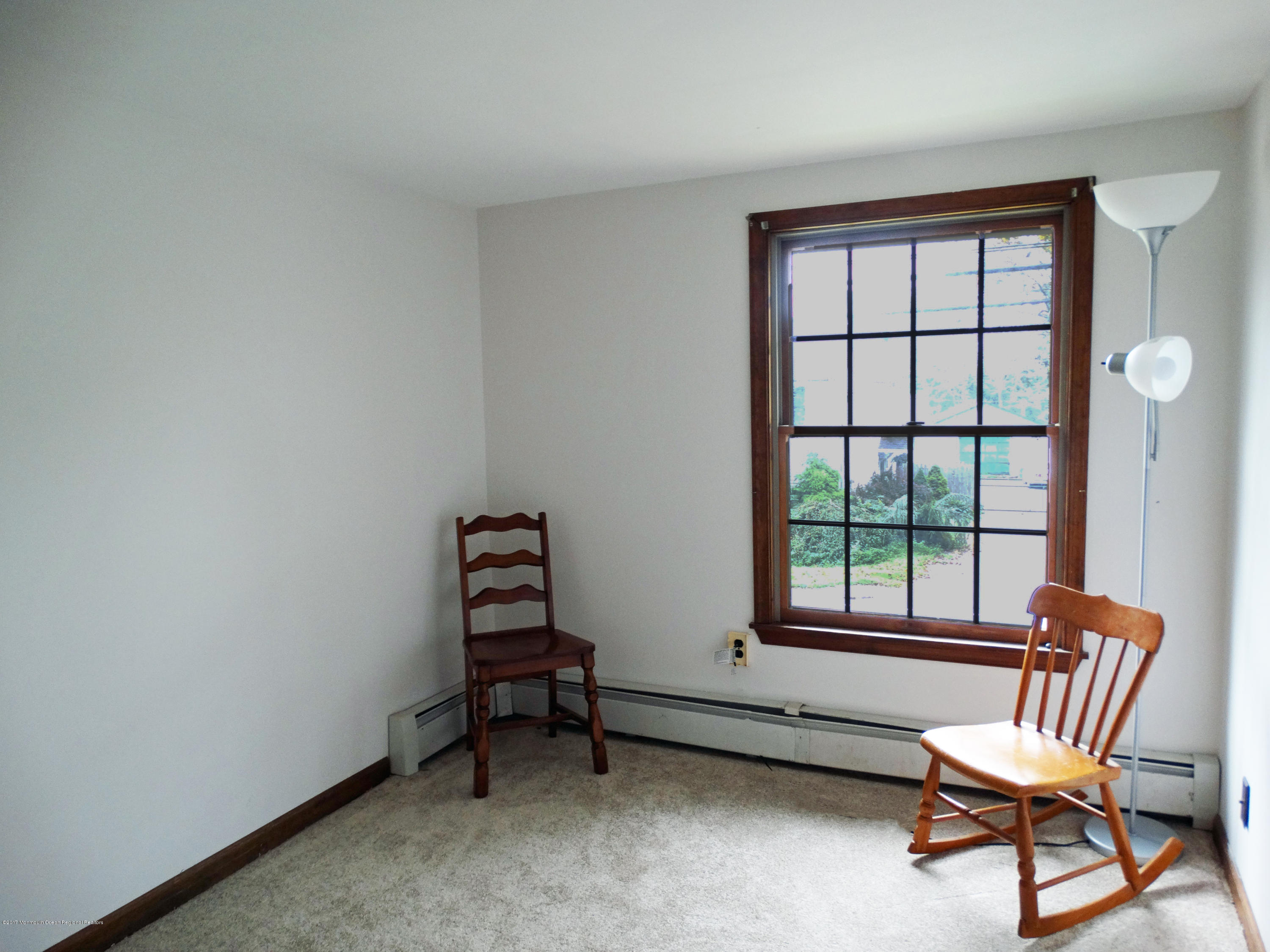 850 Adelphia Road Freehold, NJ 07728 - Photo 18 of 25 a room with chairs and a window
