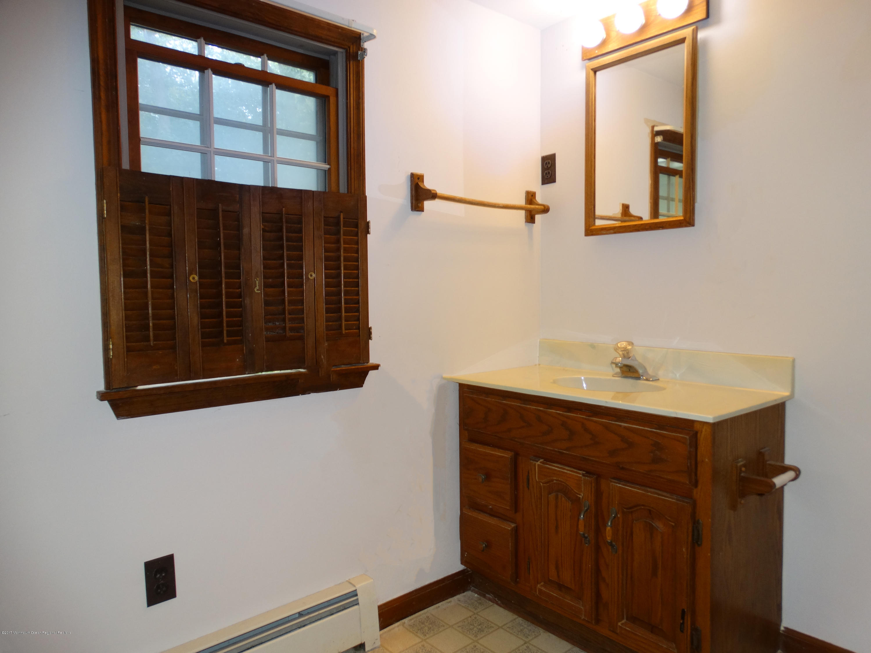 850 Adelphia Road Freehold, NJ 07728 - Photo 20 of 25 a bathroom with a sink and a mirror