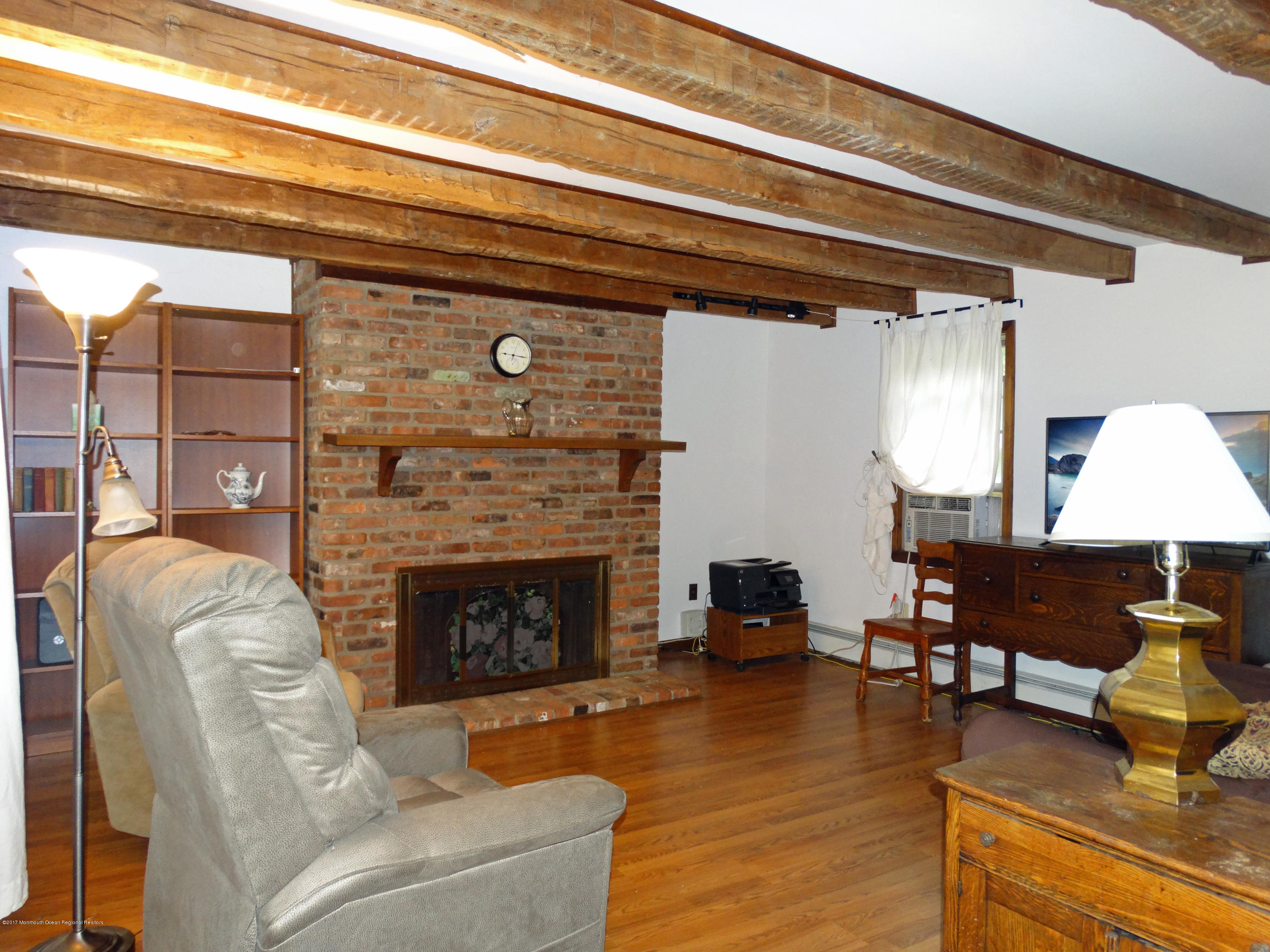 850 Adelphia Road Freehold, NJ 07728 - Photo 2 of 25 a living room with furniture and a fireplace