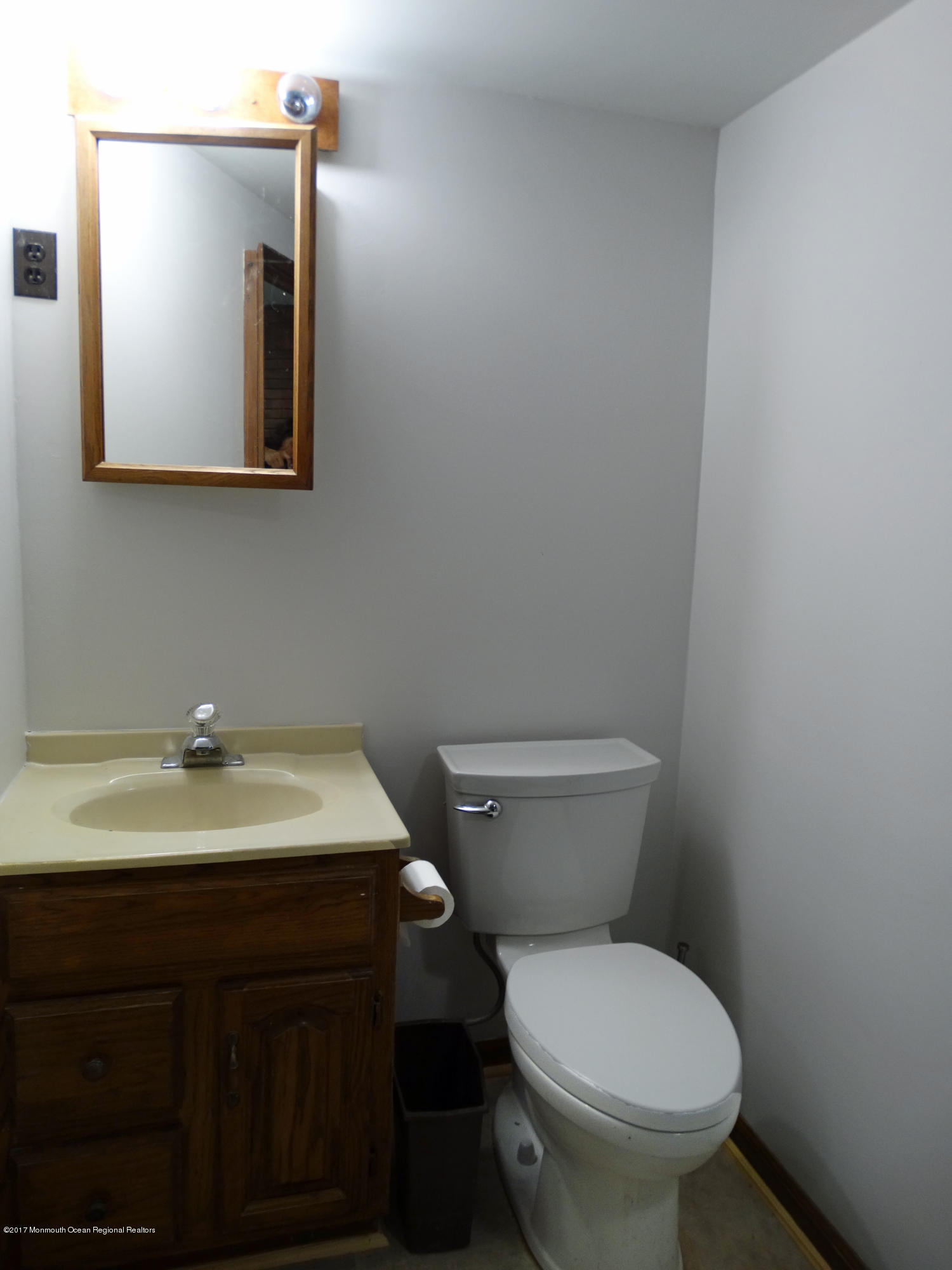 850 Adelphia Road Freehold, NJ 07728 - Photo 21 of 25 a bathroom with a toilet sink and mirror