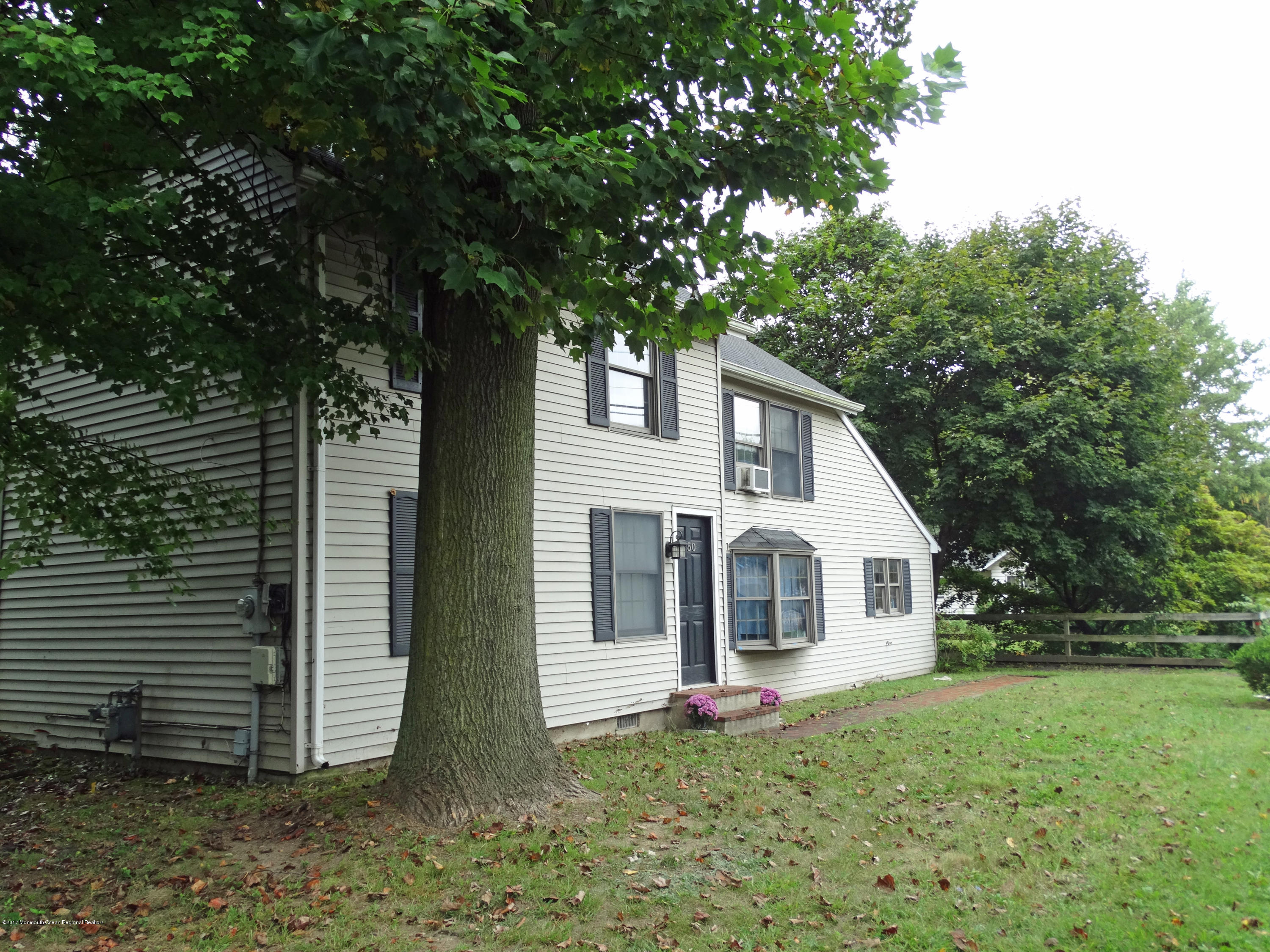 850 Adelphia Road Freehold, NJ 07728 - Photo 25 of 25 a view of a white house with a yard