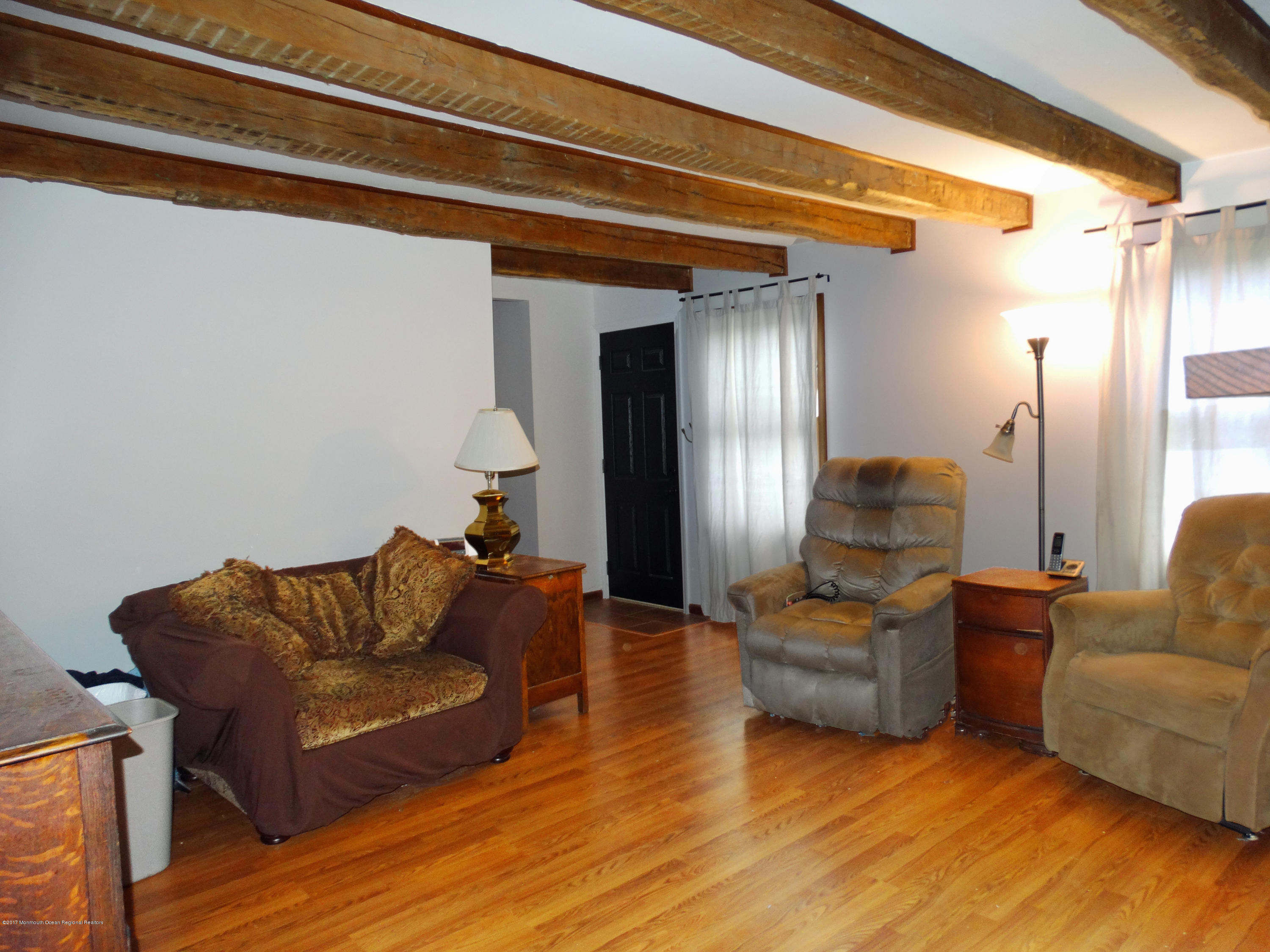850 Adelphia Road Freehold, NJ 07728 - Photo 3 of 25 a living room with furniture and a lamp