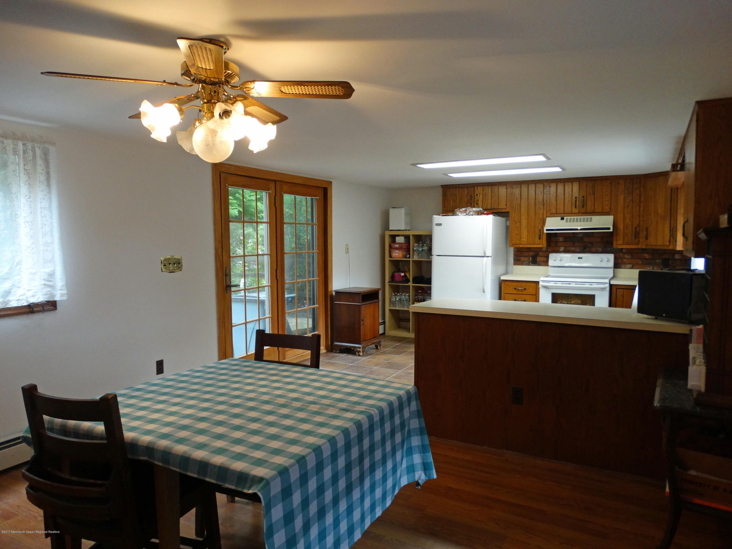 850 Adelphia Road Freehold, NJ 07728 - Photo 6 of 25 a bedroom with a bed and wooden floor