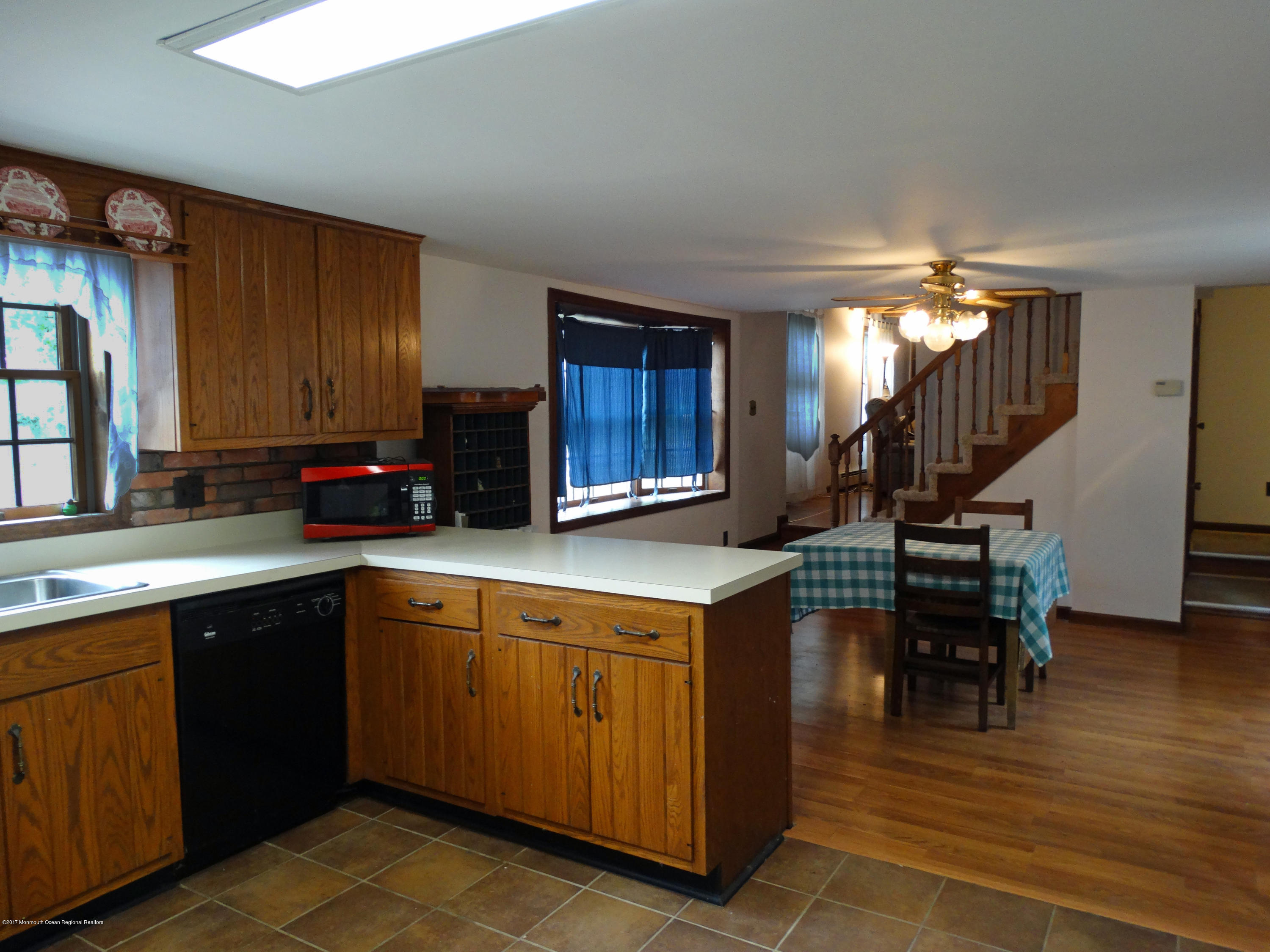 850 Adelphia Road Freehold, NJ 07728 - Photo 9 of 25 a kitchen with a sink cabinets and wooden floor