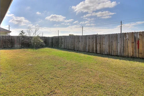 a view of a swimming pool and an outdoor space