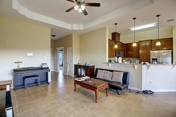a lobby with furniture and kitchen view