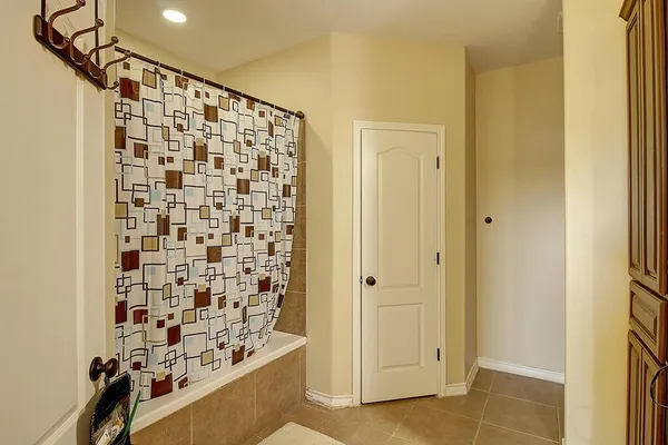 a bathroom with a shower and a sink