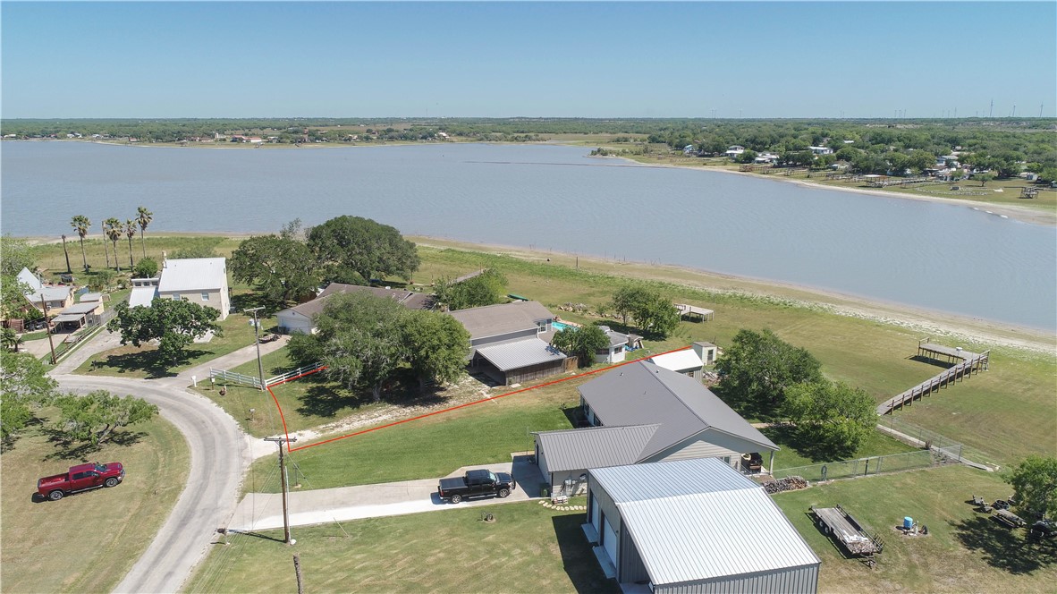 132 Zenna Drive Mathis, TX 78368 - Photo 3 of 40 an aerial view of a city with lots of residential buildings ocean and mountain view in back