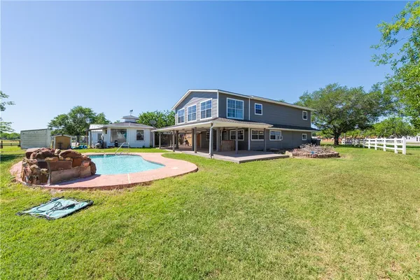 a view of a house with a big yard