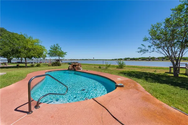 a view of a swimming pool and outdoor space