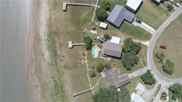 an aerial view of a house with outdoor space