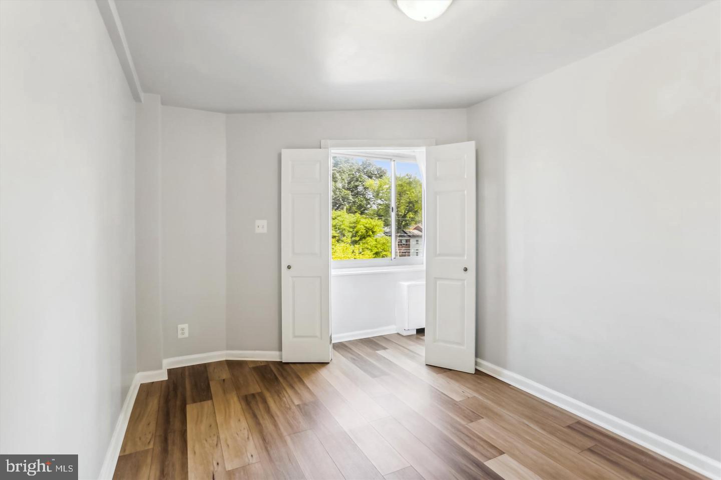 1900 Lyttonsville Road, Unit 602 Silver Spring, MD 20910 - Photo 10 of 43 a view of an empty room and window