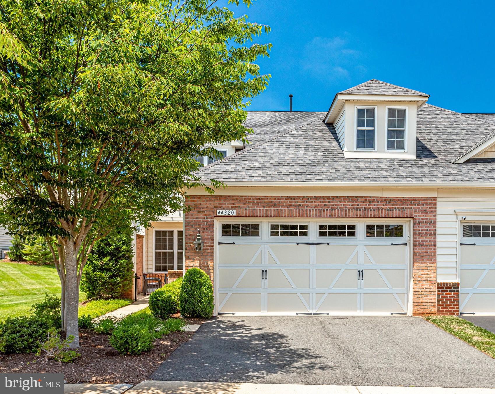 Beautifully maintained end unit with brick  front