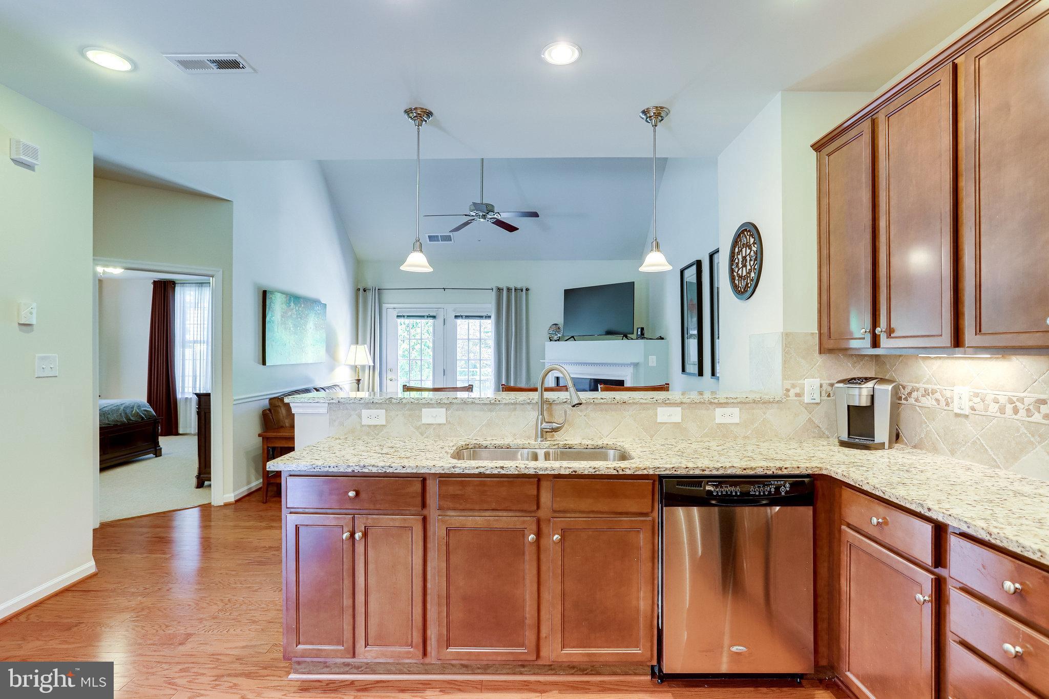 44320 McHenry Square Ashburn, VA 20147 - Photo 11 of 55 Kitchen opens to family room