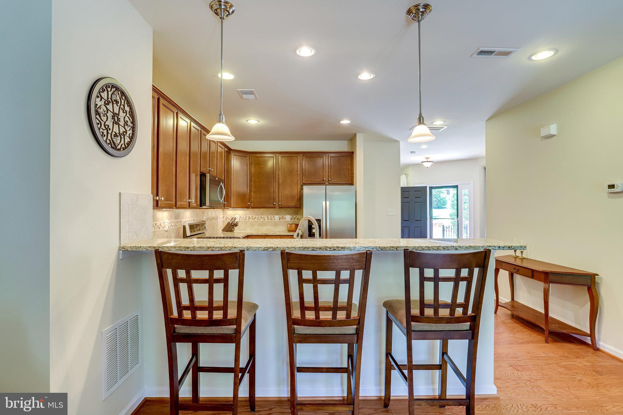 44320 McHenry Square Ashburn, VA 20147 - Photo 13 of 55 Breakfast bar with 3 barstools (barstools convey)