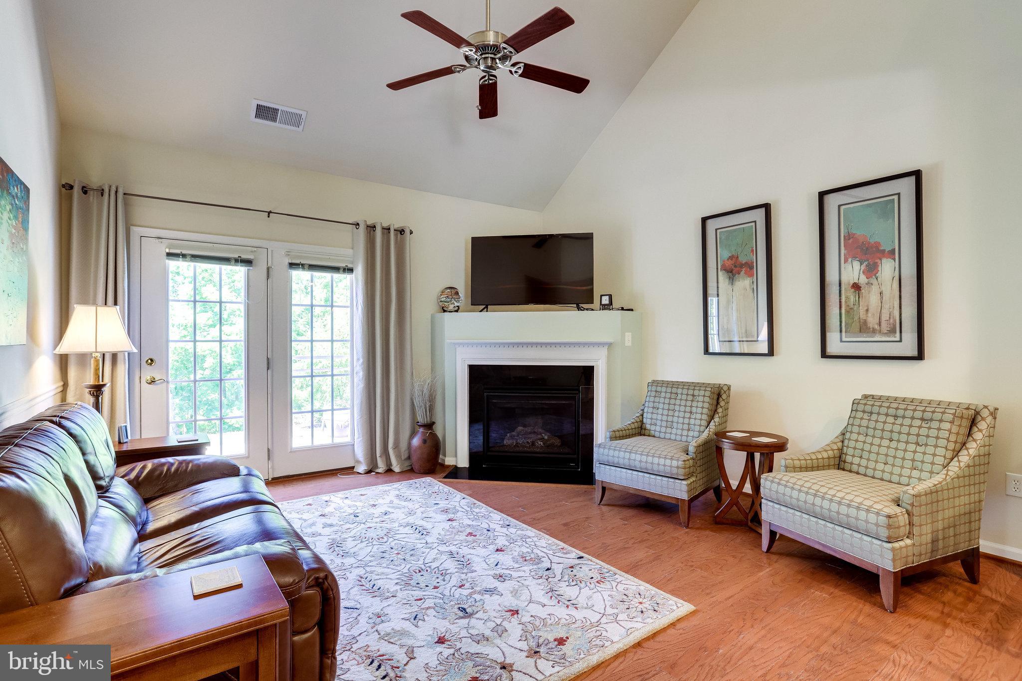 44320 McHenry Square Ashburn, VA 20147 - Photo 15 of 55 Charming living room with door to patio