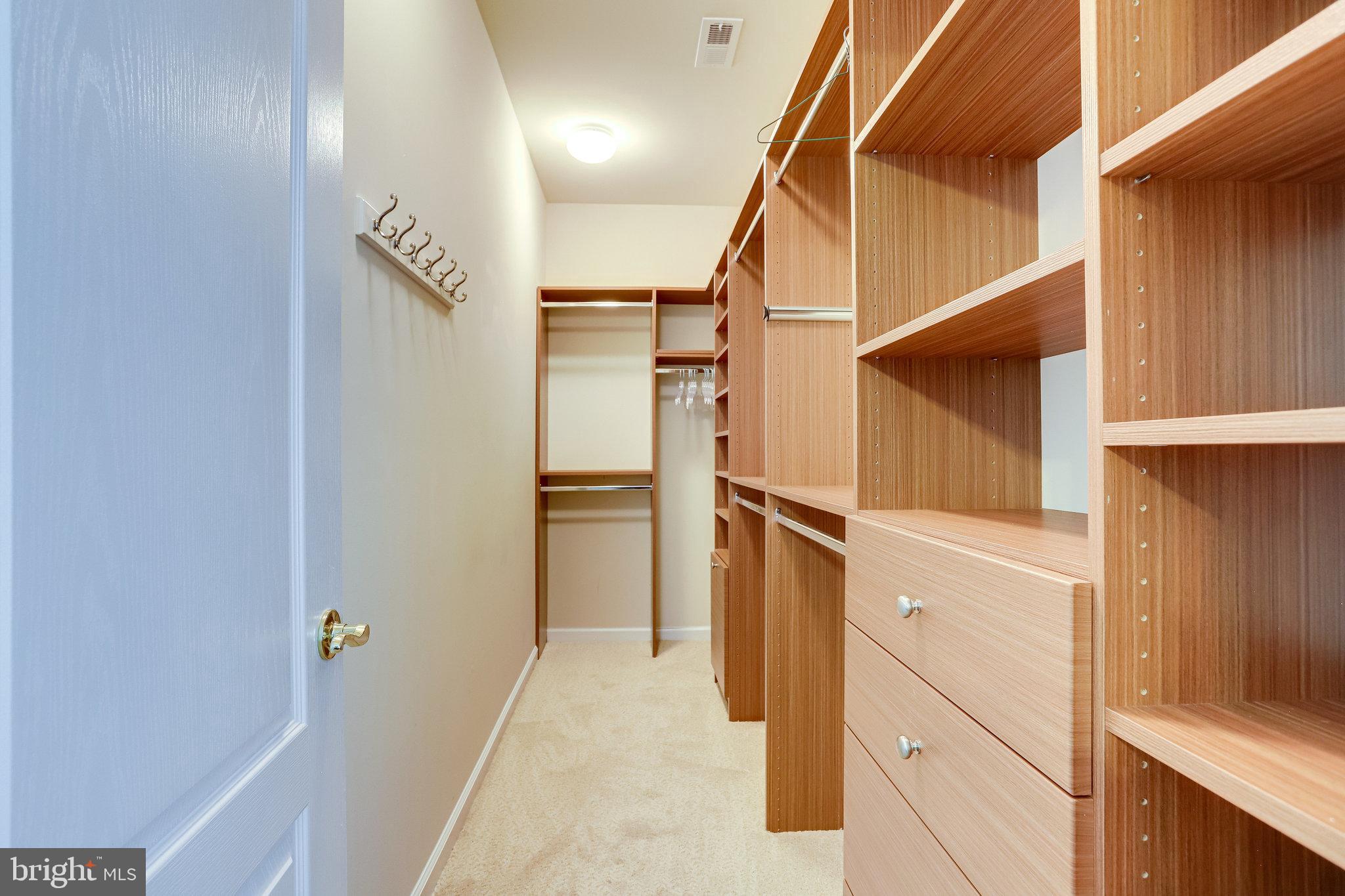 44320 McHenry Square Ashburn, VA 20147 - Photo 21 of 55 Large walk-in closet with built-ins adjoins MBR