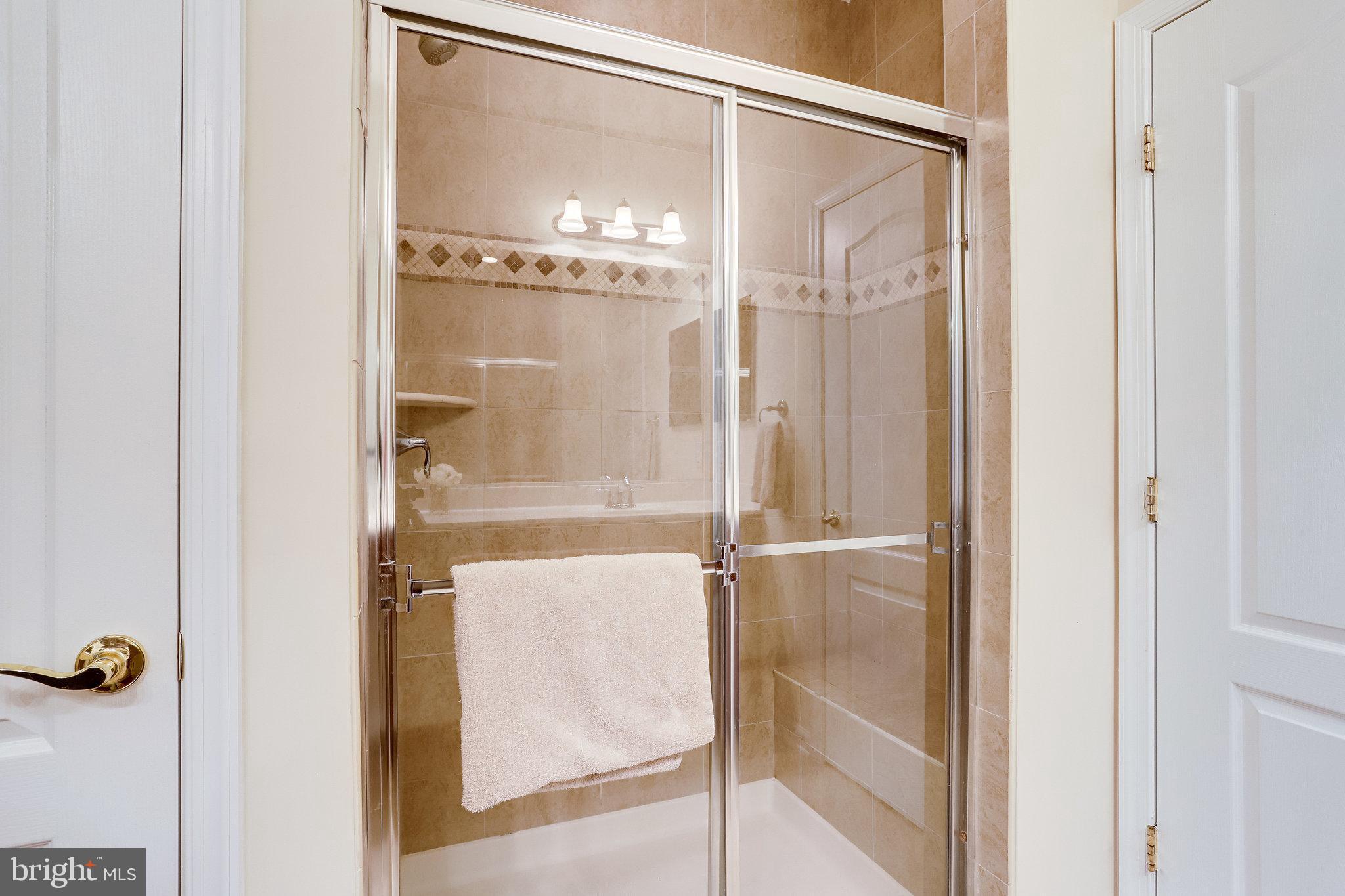 44320 McHenry Square Ashburn, VA 20147 - Photo 23 of 55 Large ceramic tile shower and linen closet