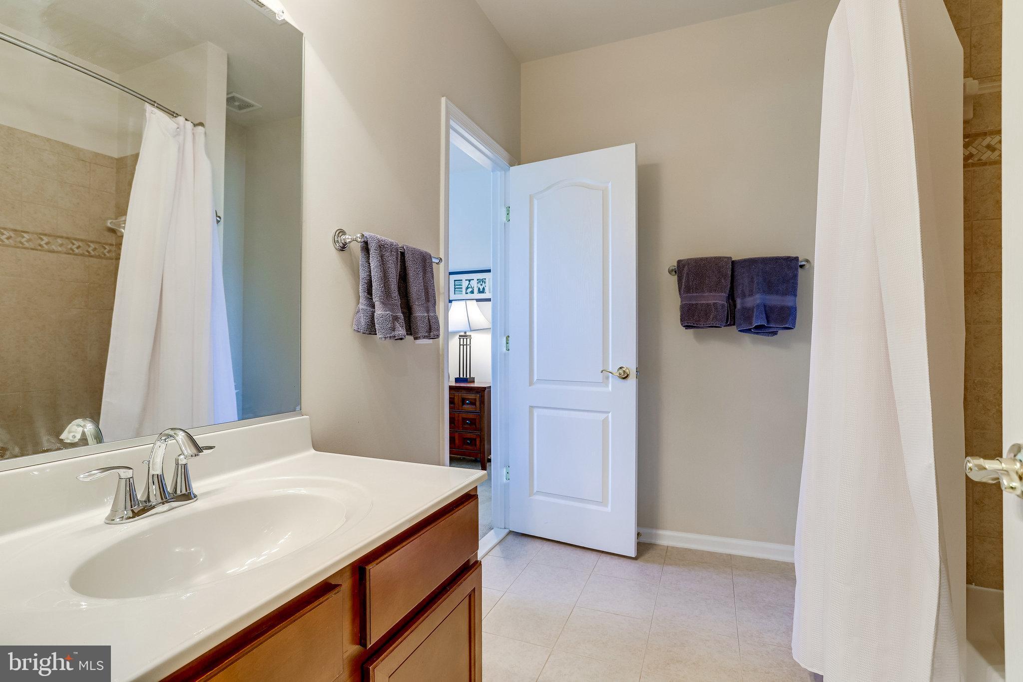 44320 McHenry Square Ashburn, VA 20147 - Photo 32 of 55 Guest bathroom has two entry doors