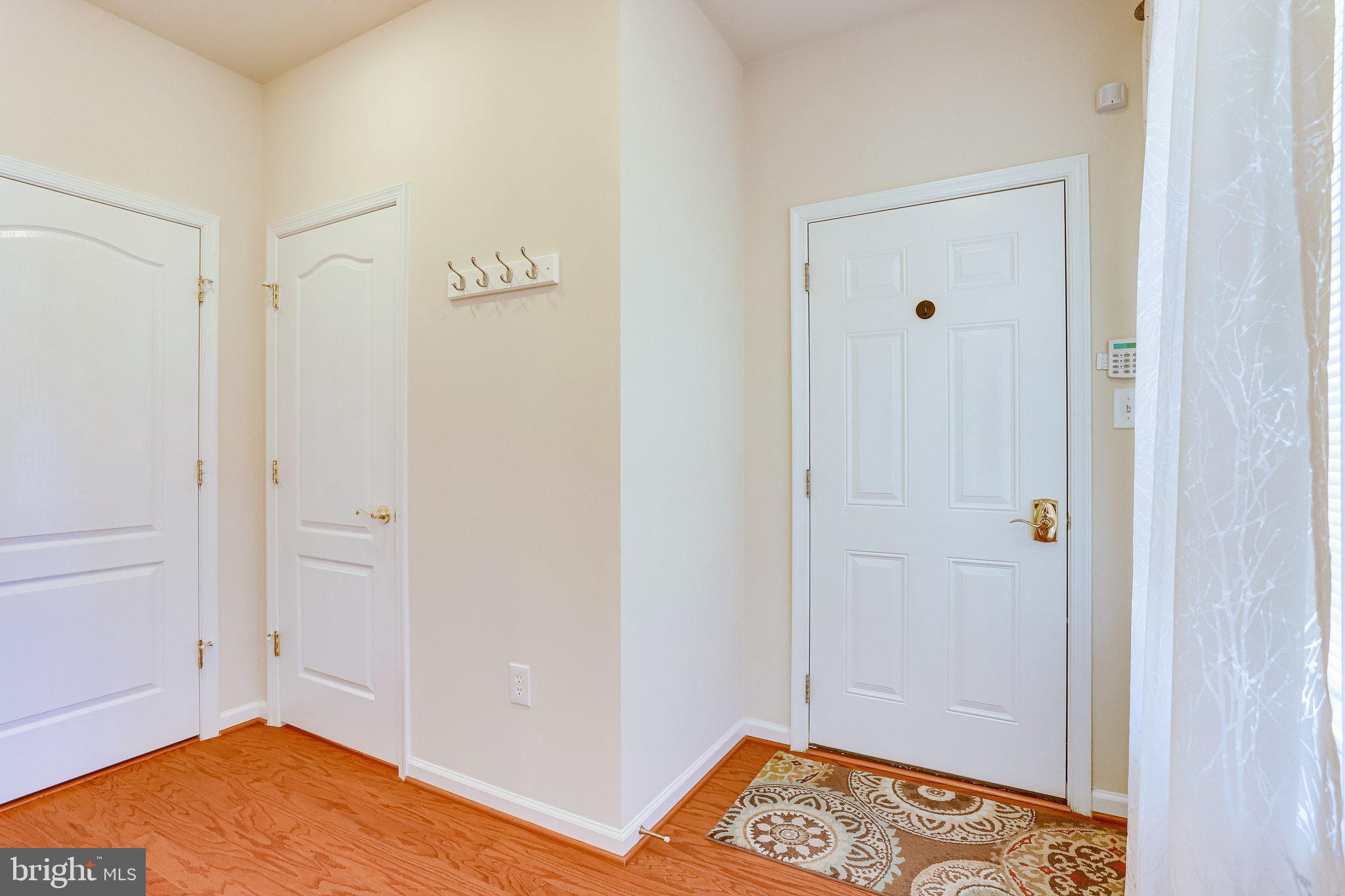 44320 McHenry Square Ashburn, VA 20147 - Photo 36 of 55 Doors to garage, powder room & laundry room
